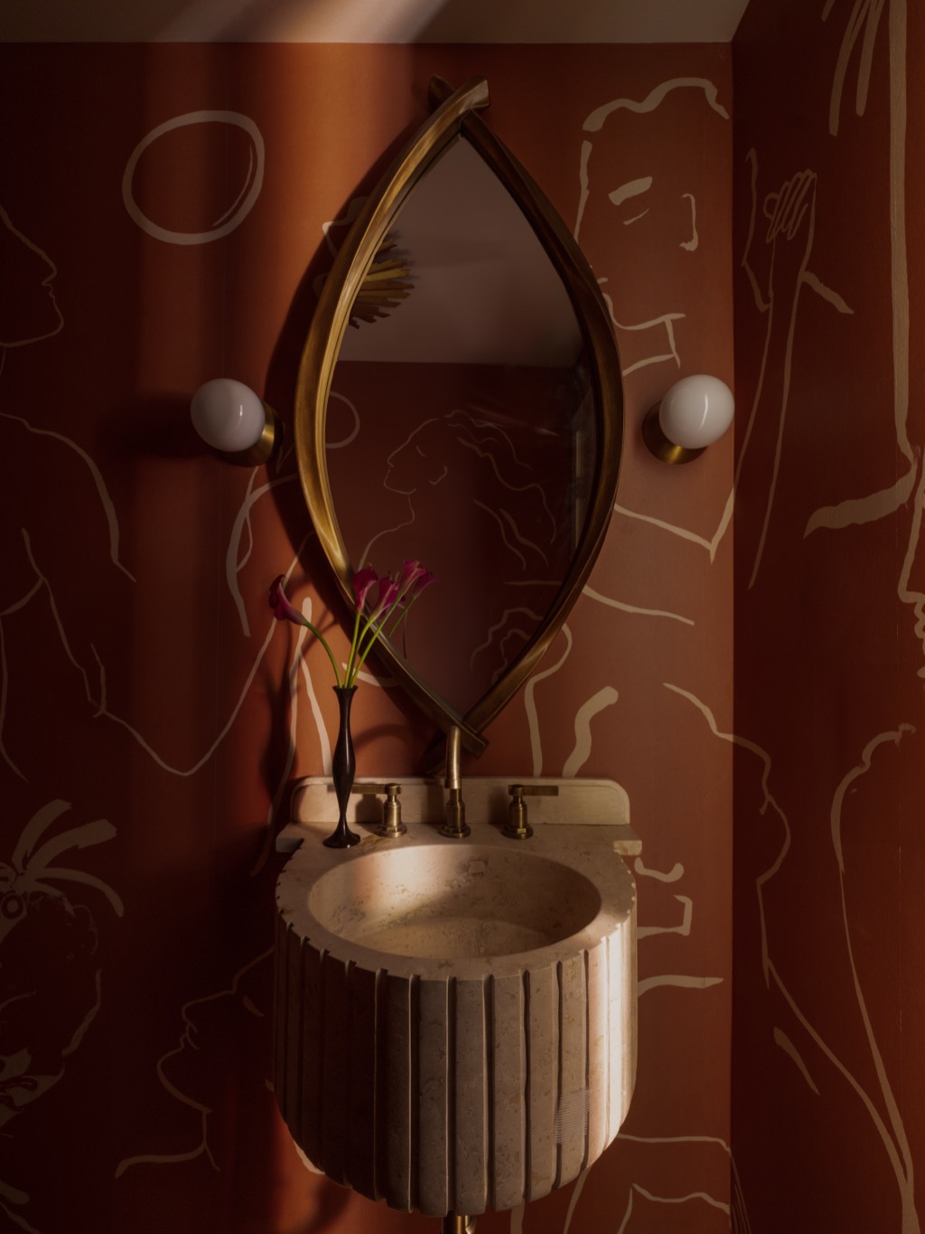 NU Curations interior design project featuring powder room mural stone sink