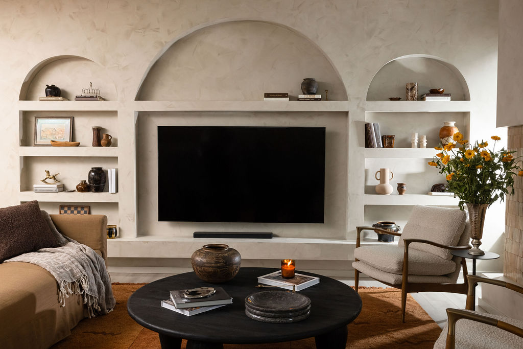 NU Curations editorial homepage hero featuring tv entertainment wall with built in niches